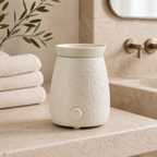 Ivory ceramic warmer on a stone bathroom counter