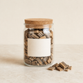 Silvery brown juniper chips in a clear glass jar