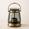 Smoked glass lantern botanical warmer with aged brass frame
