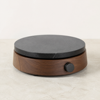 Dark stone electric warming plate on a walnut base